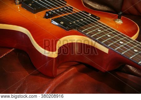 A Ssolid Wooden Single Cutaway Electric Rock Guitar With Binding