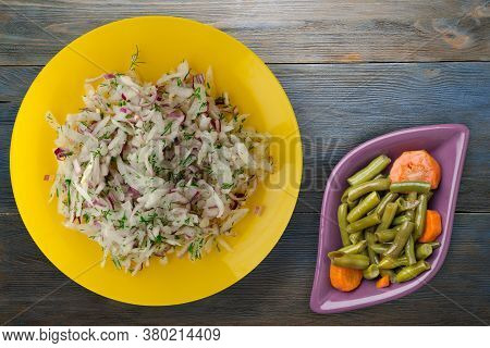 Salad Daikon, Onions And Dill On Blue Grey Wooden Background. Salad On Yellow Plate With Vegetarian 