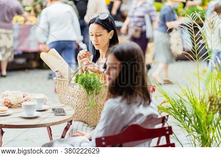 Brunette Slim Sensual Mother And Her Teenager Daughter Relaxing After Shopping At Farmer Market, Sit