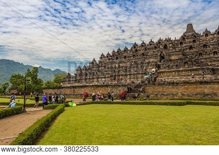 Borobudur, Indonesia - October 15th 2016: A Line Of Tourists Ascending The Stairs On The Borobudur B
