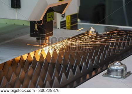 The Fiber Laser Cutting Machine Cutting  Machine Cut The Metal Plate. The Hi-technology Sheet Metal 