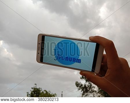 District Katni, India - May 23, 2020: Woman Holding Smart Phone With Innurm, Jawaharlal Nehru Nation