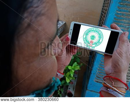 District Katni, India - May 23, 2020: Woman Holding Smart Phone With Displayed Government Of Andhra 