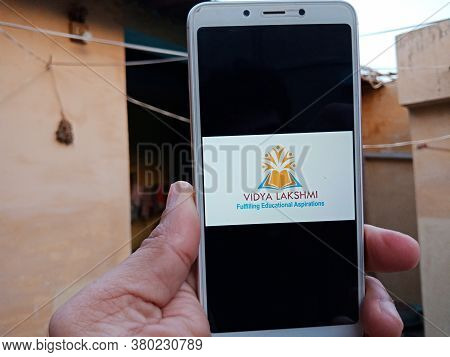 District Katni, India - May 23, 2020: Woman Holding Smart Phone With Displayed Vidya Lakshmi Portal 