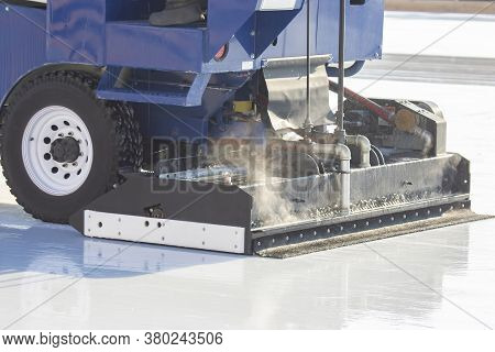 Special Machine For Cleaning Ice On An Ice Rink At Work. Transport Industry