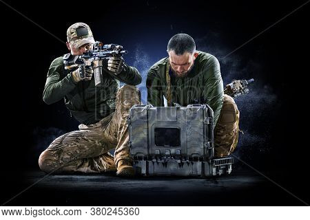 Army Soldiers In Protective Combat Uniform Holding Special Operations Forces Combat Assault Rifle On
