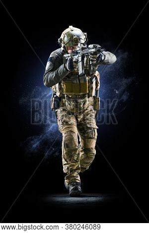 Army Soldier In Protective Combat Uniform Holding Special Operations Forces Combat Assault Rifle On 