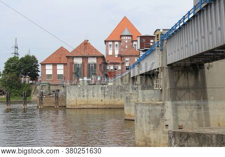 Dorverden, Germany, 19 July 2020: The Weir On The Weser River 'weserwehr', And Statkraft Power Stati