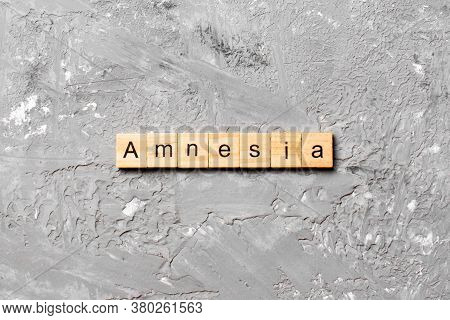 Amnesia Word Written On Wood Block. Amnesia Text On Table, Concept