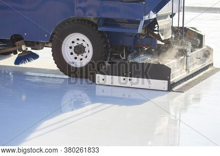 Special Machine For Cleaning Ice On An Ice Rink At Work. Transport Industry