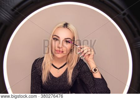 Beautiful Girl Woman Lady, Applying Mascara On Her Long Eyelashes Looking In Ring Light Mirror Isola