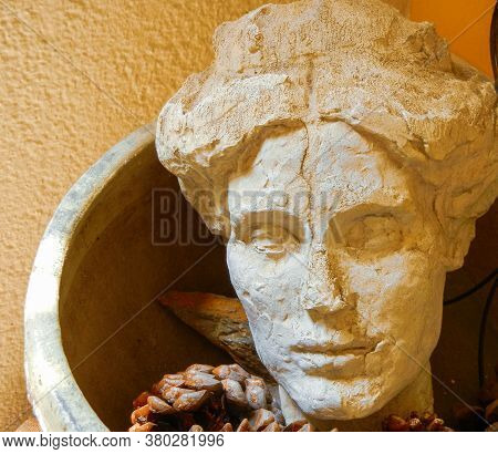 Carved Stone Bust In A Basket Colliure