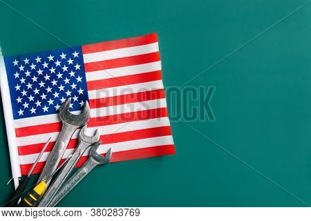 Labor Day Concept, Different Kinds Wrenches With American Flag On Dark Green. First Monday In Septem