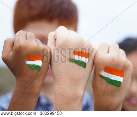 Kids Fist Hands Painted With Indian Falg During Independence Day Or Republic Day Celebration - Conce