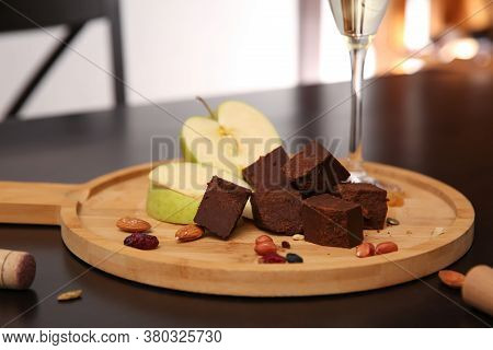 Delicious Brunost Cheese, Apple And Nuts On Table, Closeup