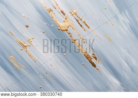 Gold Potal Brush Strokes And Stains On Randomly Painted Surface. Gray Marble Background Or Texture