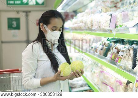 Women Looking Clothes In Shopping Mall. Asian Women Smileing Happy To Choice And Tried Clothes In Sh