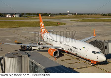 Lviv, Ukraine - 09 Aug 2020: Sky Up Charter Plane Unloads Baggage At The Lviv Lwo Danylo Halytski Na