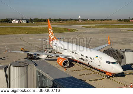 Lviv, Ukraine - 09 Aug 2020: Sky Up Charter Plane Unloads Baggage At The Lviv Lwo Danylo Halytski Na