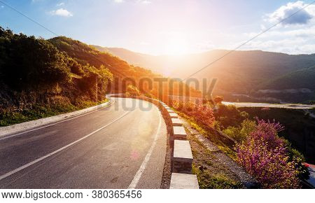 Road In Mountains. Kalabaka Region. Meteora. Greece. Empty Asphalt Road With Glowing Perfect Sky And