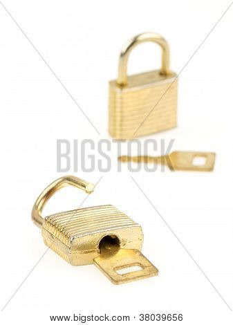 Opened En Closed Padlocks And Keys Isolated, Focus In The Front