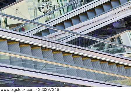 Crisscross Escalators In Shopping Center. Empty Escalators Stairs Up And Down In Office Building, Sh