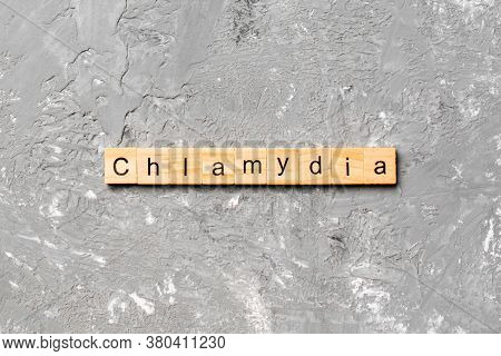 Chlamydia Word Written On Wood Block. Chlamydia Text On Table, Concept