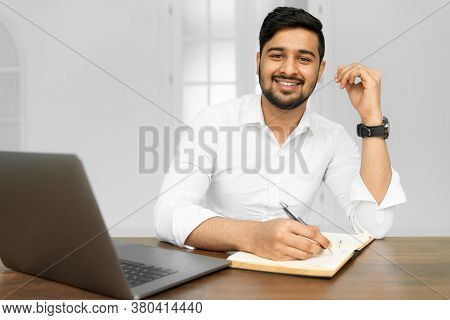 Asian Student Studying, Learning Language, Online Education Concept. Portrait Of Handsome Indian Bus
