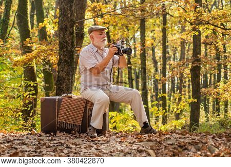 Used To Manual Settings. Old Man Shoot In Nature. Landscape And Nature Photo Shooting. Old Photograp