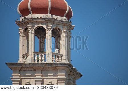 Zoomed In View Of The Christian Church Belltower In The Small Town Of Sutivan On The Island Of Brac.