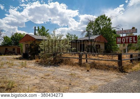 Shoshoni, Wyoming - July 25, 2020: Abandoned Shoshoni Motel, With Its Vintage Neon Sign Sits Decayin