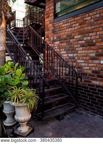 House Frontyard Cultured Veneer Stone Work Siding And Rod Iron Stairs