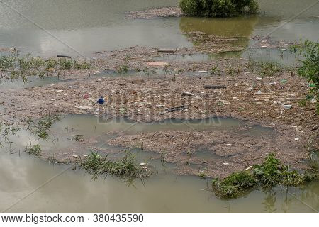 Daejeon, South Korea; August 9, 2020: For Editorial Use Only. Island Of Trash And Debris Floating On