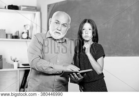 Teacher Help Schoolgirl. Back To School. School Lesson. Little Girl With Man Tutor Study. Experience