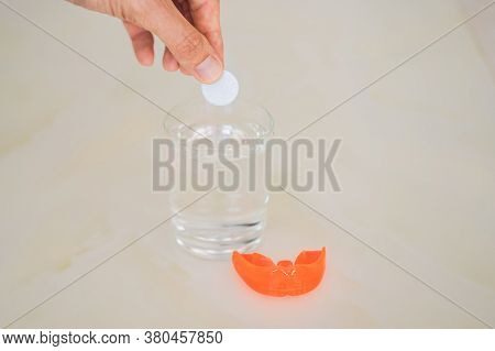 Dental Mouthpiece Cleaning Tablet In A Glass