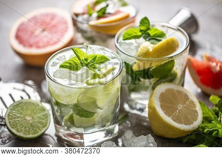Three Colorful Gin Tonic Cocktails In Whiskey Glasses On Bar Counter In Pup Or Restaurant.