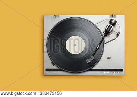 Vinyl Player With Long Play Or Lp Record On Yellow Background. Top View, Copy Space.