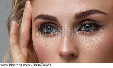Closeup Female Eyes With Bright Make-up, Great Shapes Brows, Extreme Long Eyelashes. Celebrate Makeu