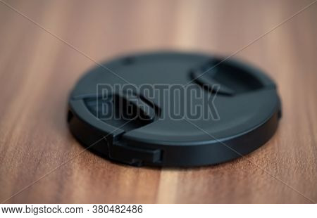 The Protective Cover From The Camera Lies On The Table