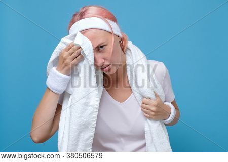 Dissatisfied Tired Woman Wiping Swet From Face After Training At Gym