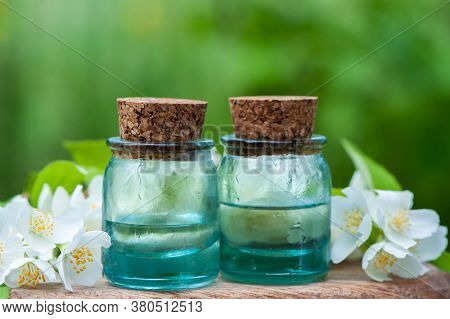 Essential Jasmine Oil. Bioproduct, Organic Cosmetics. Perfumery, Cosmetology, Aromatherapy