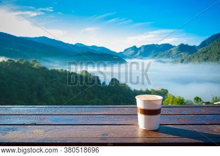 Coffee Cup In The Morning With Mountain View Background.
A Cup Of Tasty Coffee With Best Scenic View