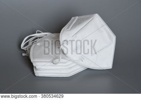 White Kn95 Or N95 Mask For Protection Pm 2.5 And Corona Virus Isolated On Grey Background. Preventio