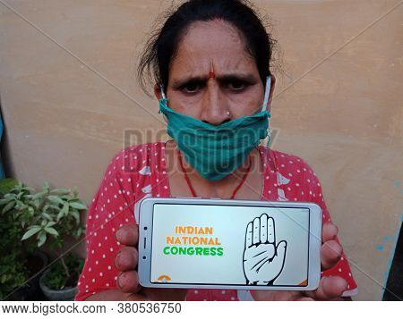 District Katni, India - 28 May 2020: An Indian Village Lady Holding Smart Phone With Displaying Indi