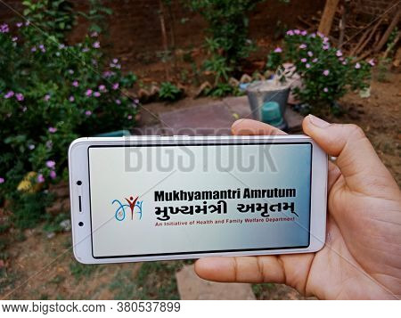 District Katni, India - 28 May 2020: An Indian Lady Holding Smart Phone With Displaying Mukhyamantri