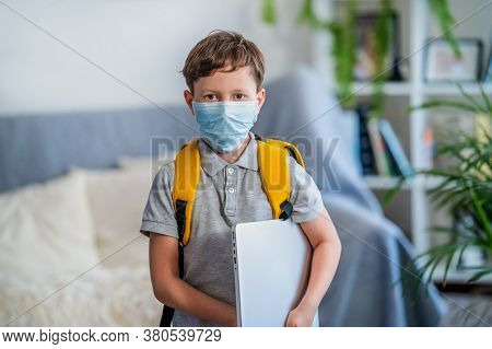 Little Schoolboy Wearing Mask During Corona Virus And Flu Outbreak. Llness Protection For Kids. Mask