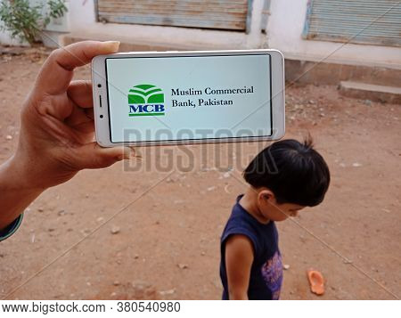 District Katni, India - June 02, 2020: An Indian Woman Holding Smart Phone With Displaying Mcb Musli
