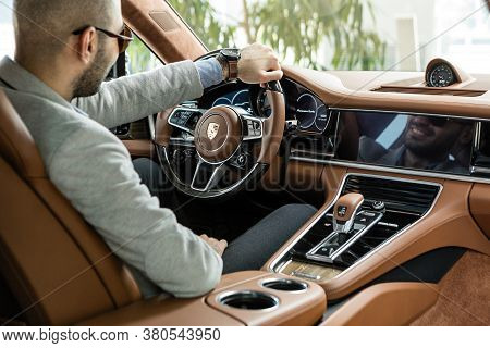11-02-2018 Baku / Azerbaijan: Porsche Panamera Turbo Yellow Interior With Man Driver