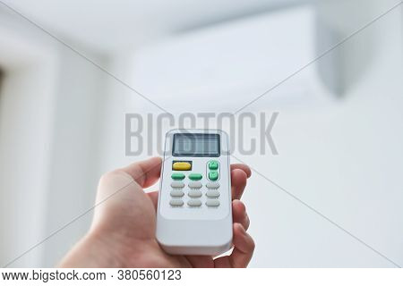 Remote Control For Air Conditioner In Hand. Room Condition Remote Control. Air Temperature Switch Fo