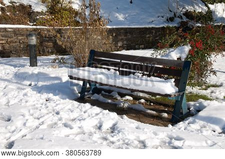 Park bench covered with snow. Sabinanigo. Huesca. Aragon. Spain.